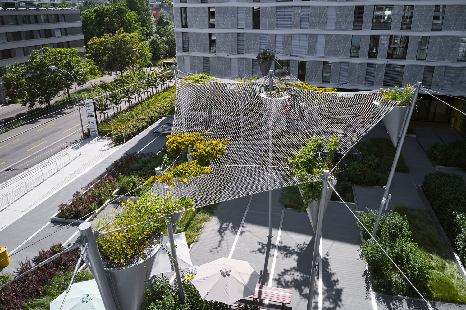 Gallery of Stainless Steel Ropes in Oerlikon Green Shade Roof - 6