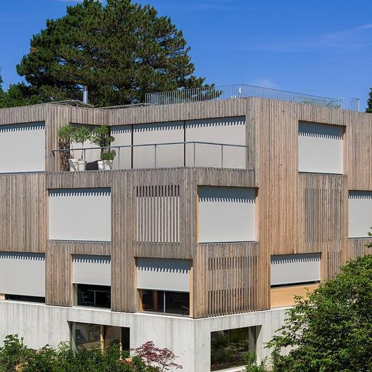 Vertical Fabric Blinds at a Wooden House in Zurich / Schenker Storen