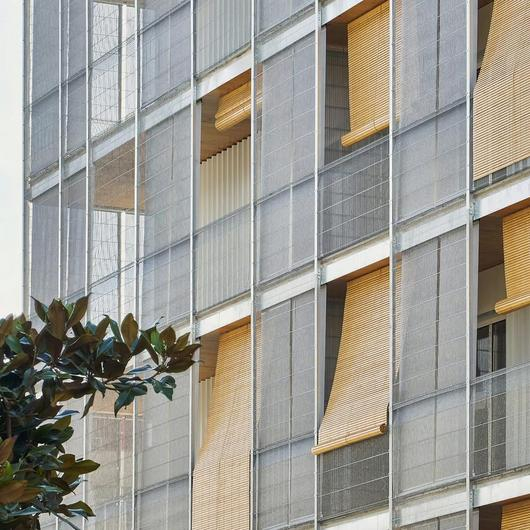 Facade Meshes in Timber Residential Building / Serge Ferrari