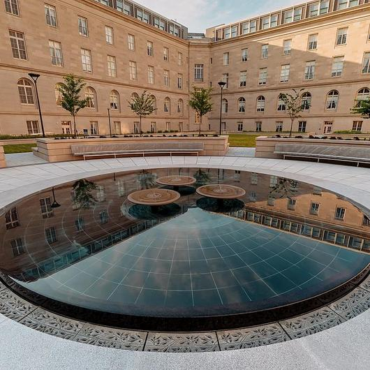 Custom Stone Grates at The Cannon Courtyard / Jonite